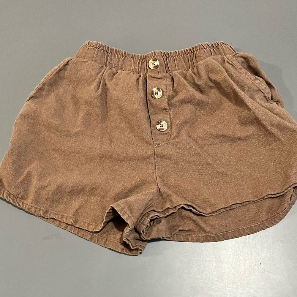 Super cute brown girl shorts with fake buttons!